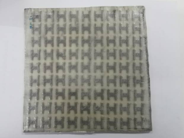 Figure 11. Photograph of laminated composite containing conductive fiber FSS material.